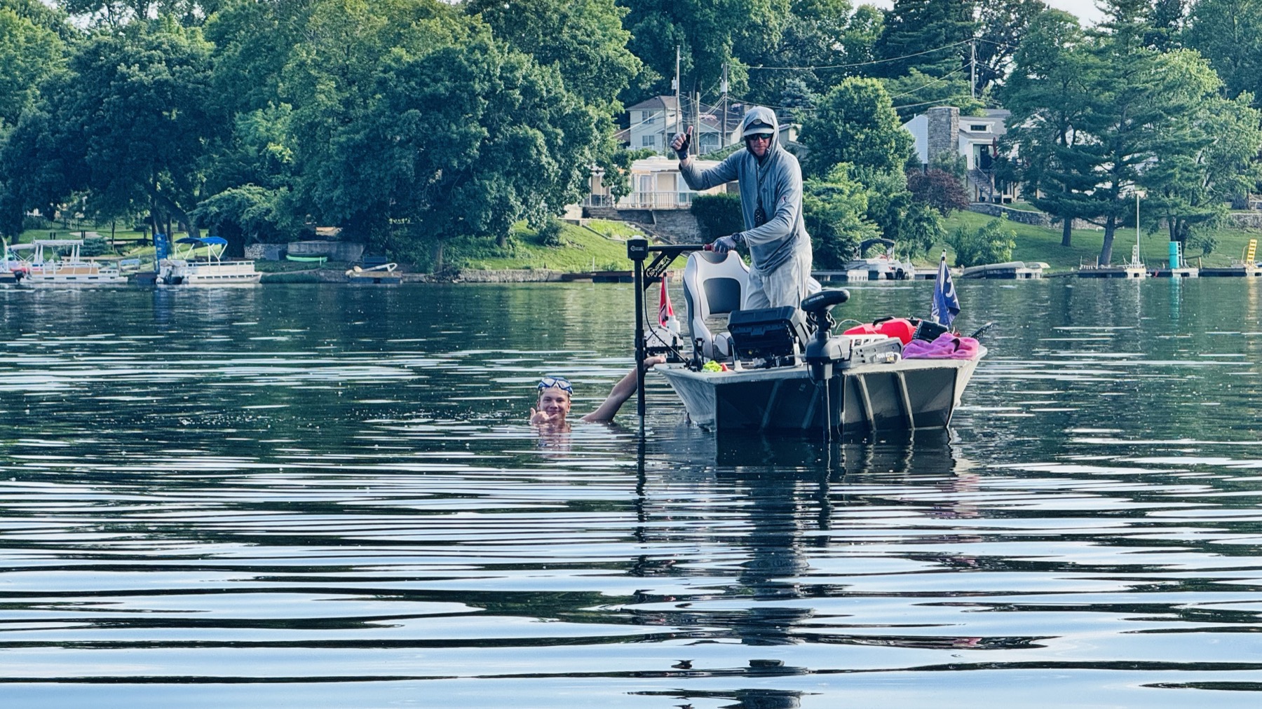 Kyle Carpenter and Ellis Morton searching Lake Waukomis for a missing trolling motor