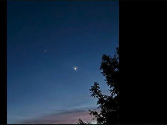 Venus and Jupiter in the northwest sky over Lake Waukomis