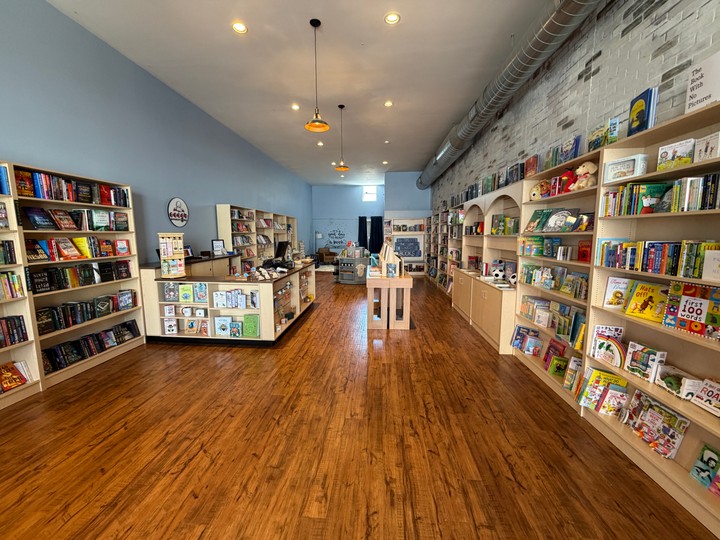 Shelves, tables, and wood floors inside Typo’s Bookstore in Parkville