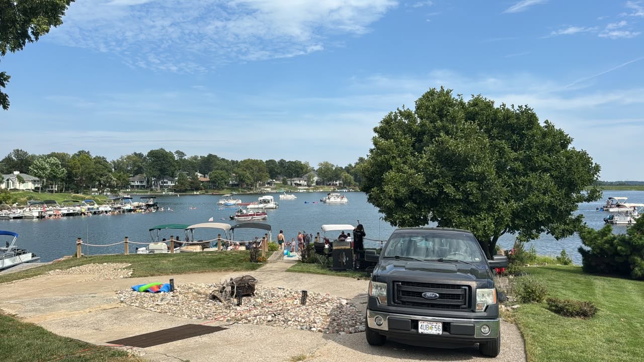 Lake Waukomis residents and pontoon boats gathered near the 300 block shoreline